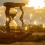 asx share price growth represented by hand holding hourglass surrounded by dollar signs