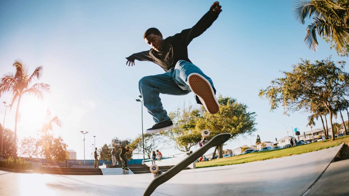 A scate board rider flies high, indicating a souring share price movement