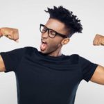 A fit man flexes his muscles, indicating a positive share price movement on the ASX market