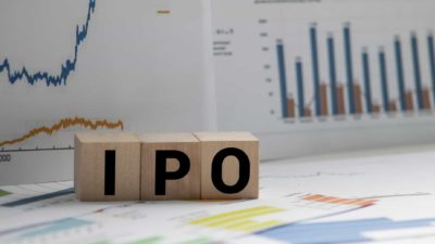 IPO spelt out on cube blocks with growth charts in background