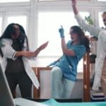 rising medical asx share price represented by excited doctors dancing in ward