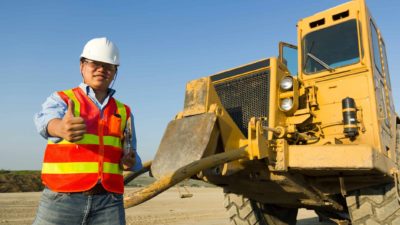 happy safety construction site worker giving the thumbs up