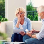 worried couple looking at their retirement savings