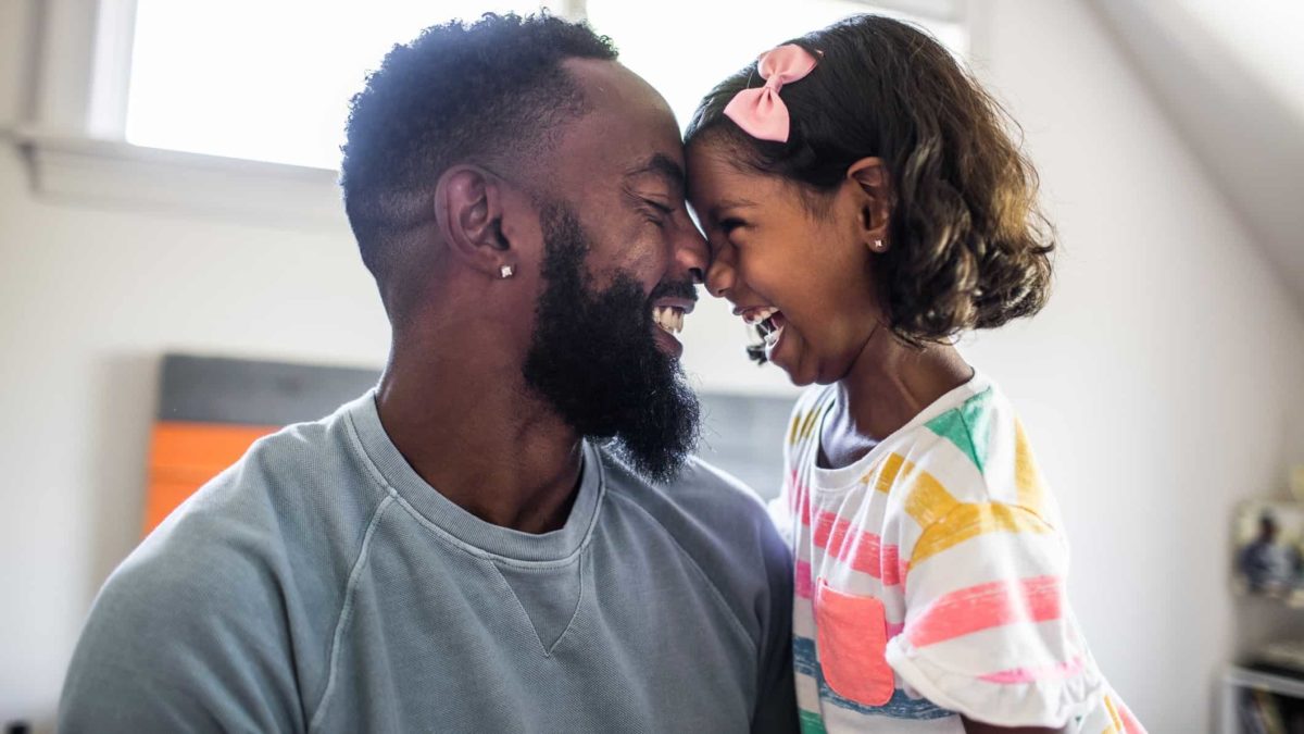 Father daughter laugh and hug