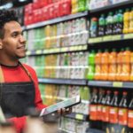 man doing stocktake at supermarket