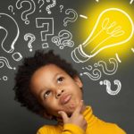 a small child holds his chin with his head on the side in a serious thinking pose against a background of graphic question marks and a yellow lightbulb.