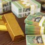 Gold bars and Australian dollar notes.