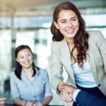 Woman shaking the hand of a man on a deal.