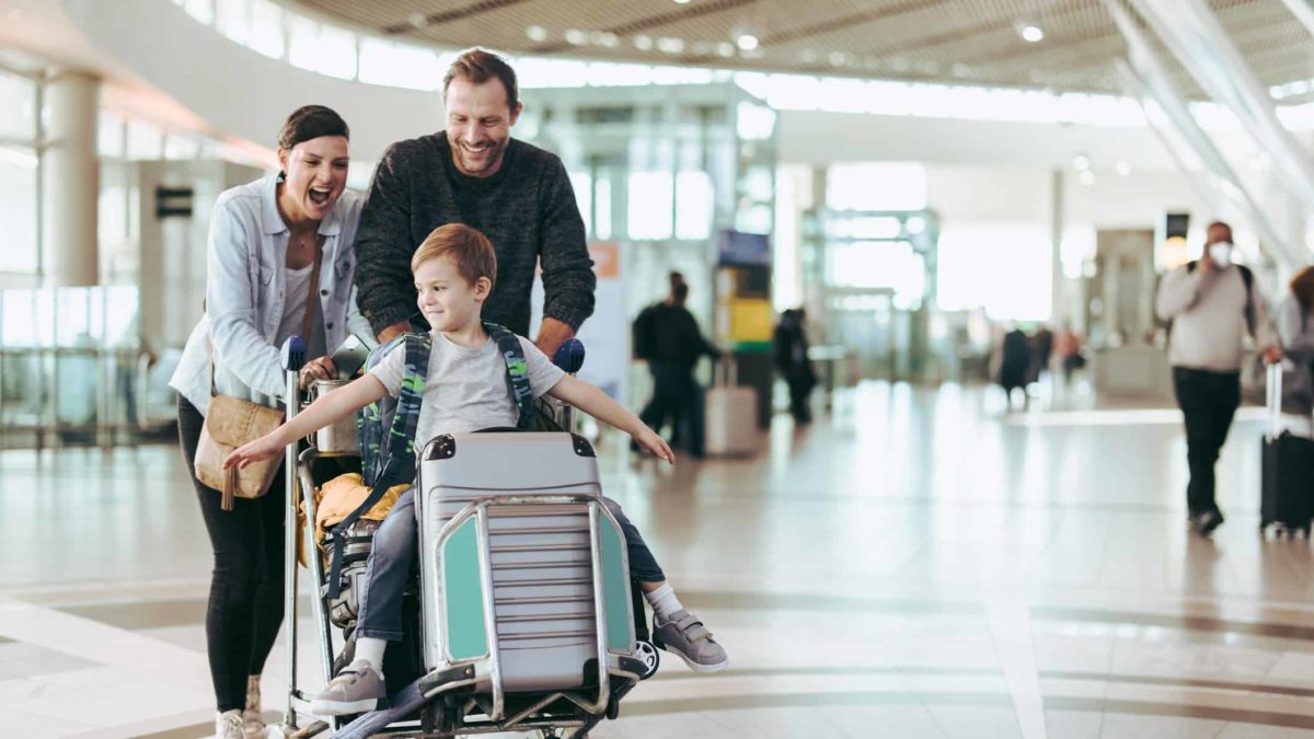 Happy family at an airport.