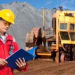 Miner looking at his notes.