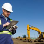 Miner looking at a tablet.