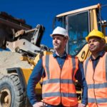 Two miners standing together.