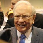 a smiling picture of legendary US investment guru Warren Buffett.