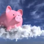 A piggy bank on the cloud in the blue sky symbolising a record high share price.