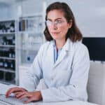 Shot of a scientist using a computer while conducting research in a laboratory.