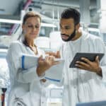 Scientists working in the laboratory and examining results.