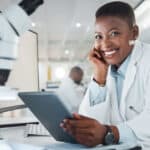 Shot of a young scientist using a digital tablet while working in a lab.