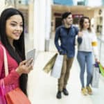 Young people shopping in mall and having fun.