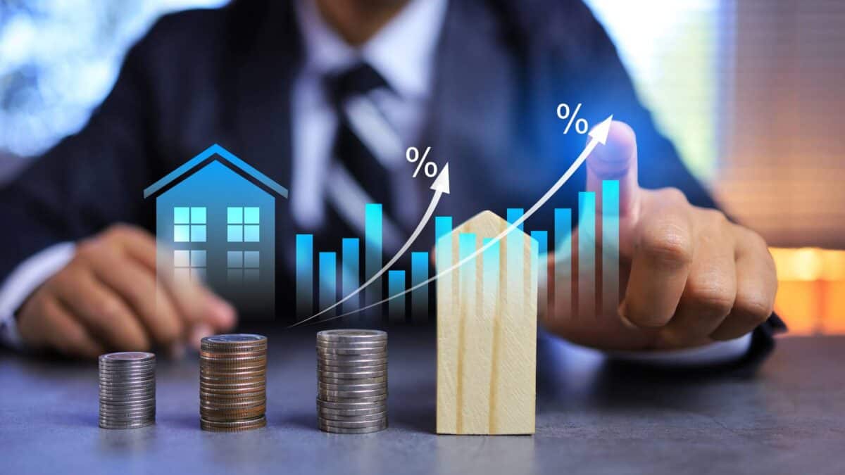 A businessman compares the growth trajectory of property versus shares.