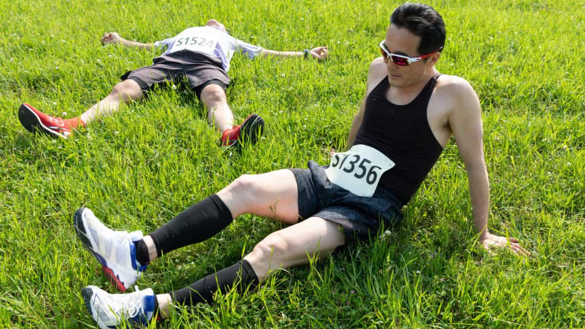 Two people tired and resting after sports race.