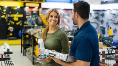 Couple looking very happy while shopping at a home improvement store.