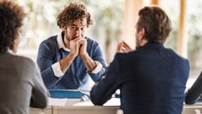 Nervous customer in discussions at a bank.