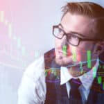 Businessman studying a high technology holographic stock market chart.